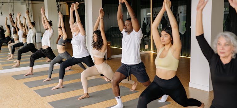 people doing yoga in class
