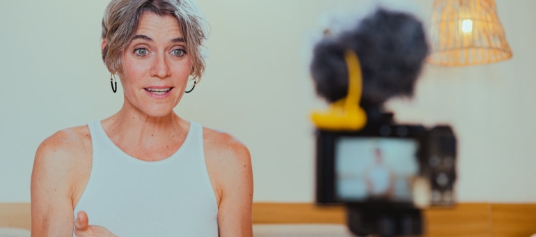 Woman recording video content about social media and SEO synergy for sober living facilities