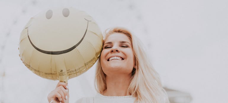 a happy woman who knows how to use SEO to promote preventive care in addiction treatment