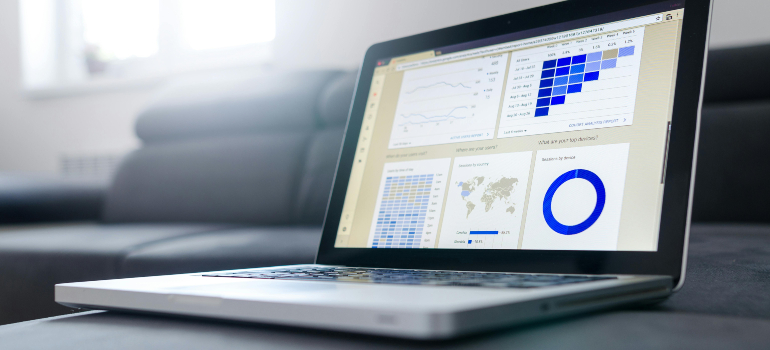 A laptop displaying analytics and data charts, representing the analysis and tracking involved in effective SEO for niche markets.