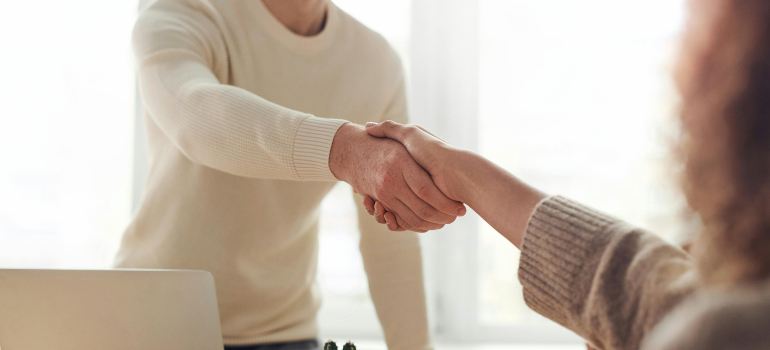 Two people shaking hands.