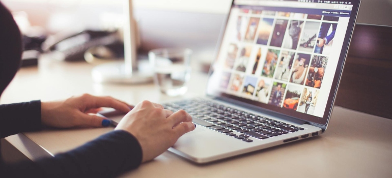 a woman on her laptop researching How to Get More Therapy Clients