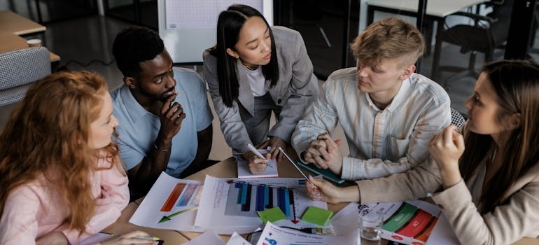 A digital marketing team discussing how to plan your holiday marketing strategy that works
