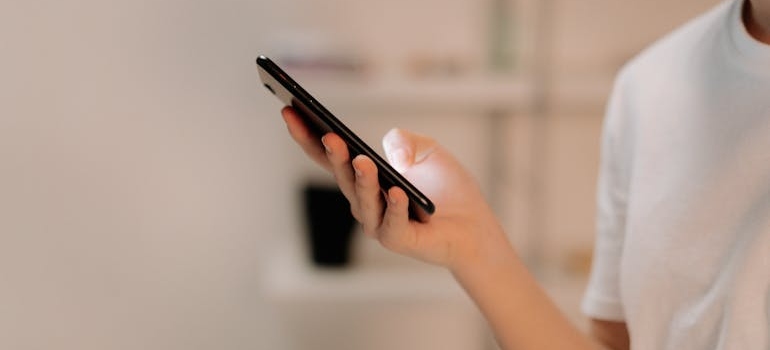 A person using a smartphone to search for mental health clinics