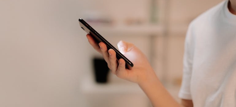 A person using their phone to search online