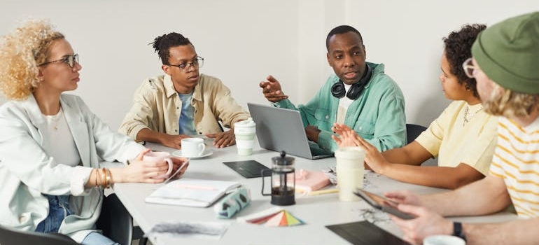 A group of marketing experts discussing the most important pages on your therapy website