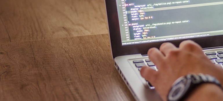 A person using a computer and making a website load faster, which is one of the CRO tweaks that instantly lift bookings