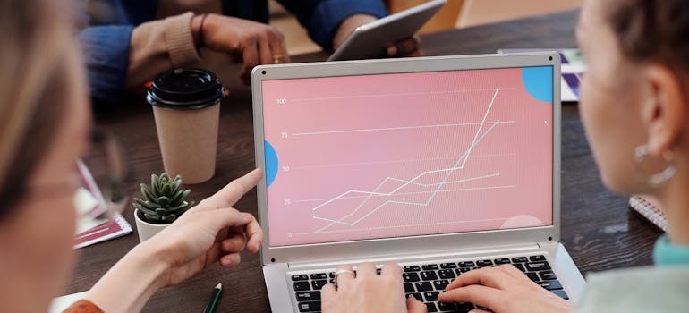 Colleagues analyzing their performance, which helps them improve their plastic surgery marketing strategies