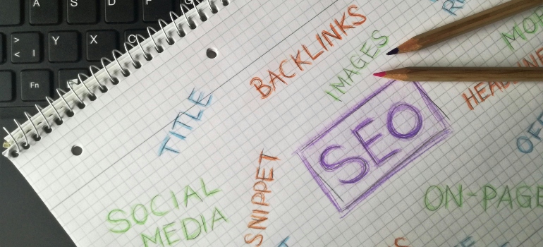 Paper with written SEO terms on it.