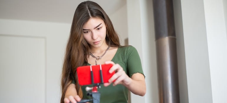 A person adjusting their camera after learning how to use video to build trust