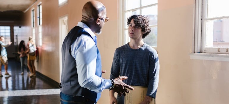 A student talking to a teacher about mental health
