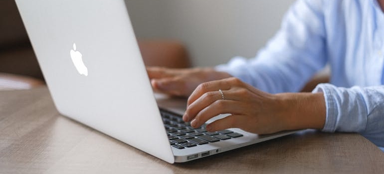A person writing FAQ pages for mental health clinics