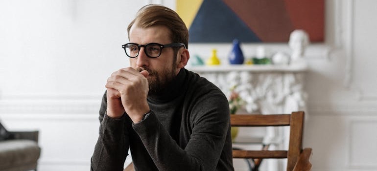A therapist sitting and thinking
