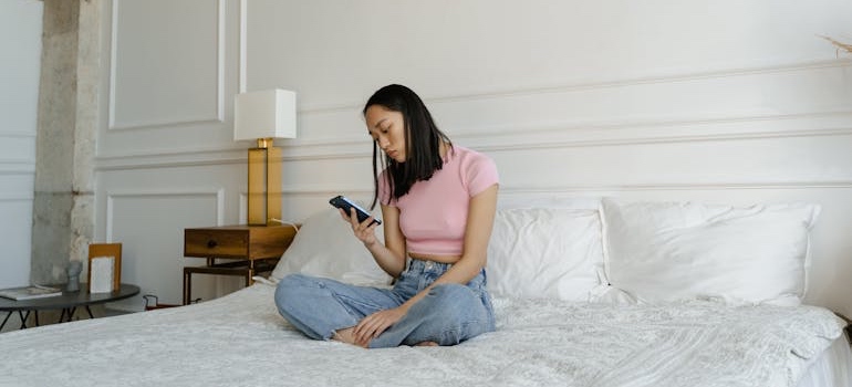 A person using a smartphone to search professional help for their loved ones, which is an example of what people type into Google