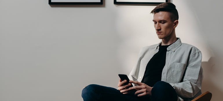 A person using a smartphone to book an appointment at a clinic