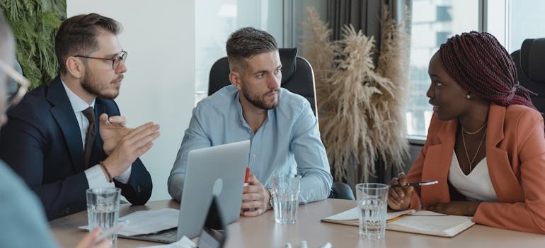 A digital marketing team having a discussing on how to optimize your website for AI search in Dubai