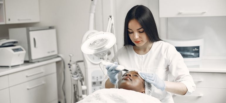 Aesthetic practitioner performing a facial treatment