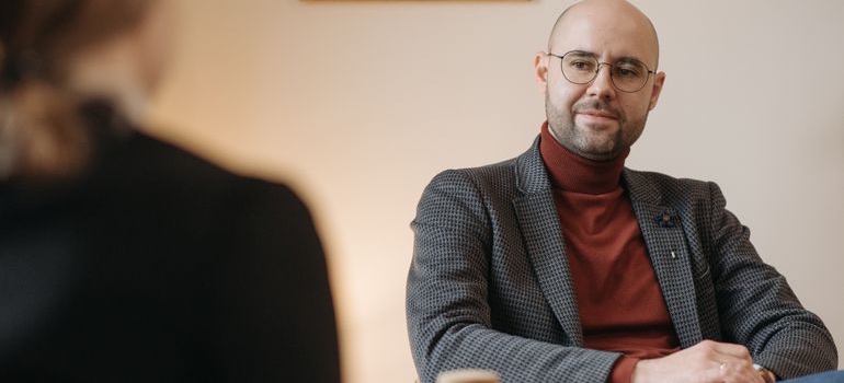 A therapist listening to a person during an individual therapy session