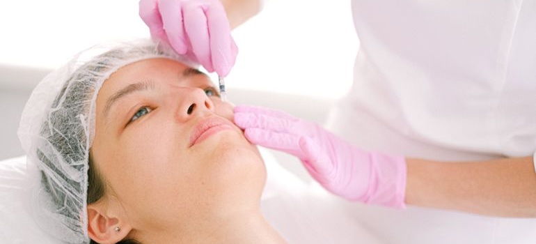 Cosmetic practitioner performing a Botox injection treatment