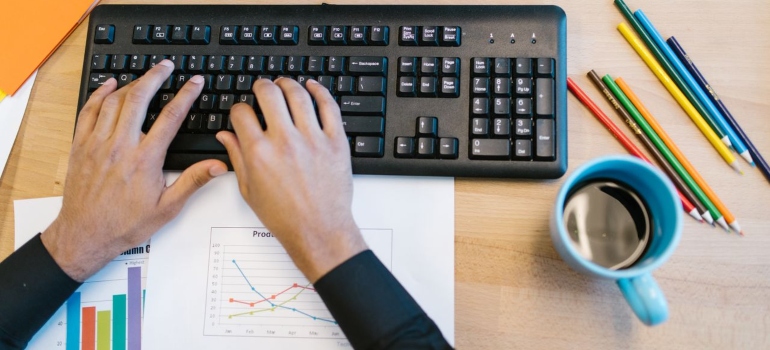a man typing on his keyboard