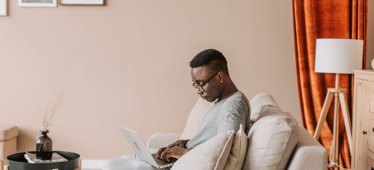 Person researching treatment options on a laptop at home