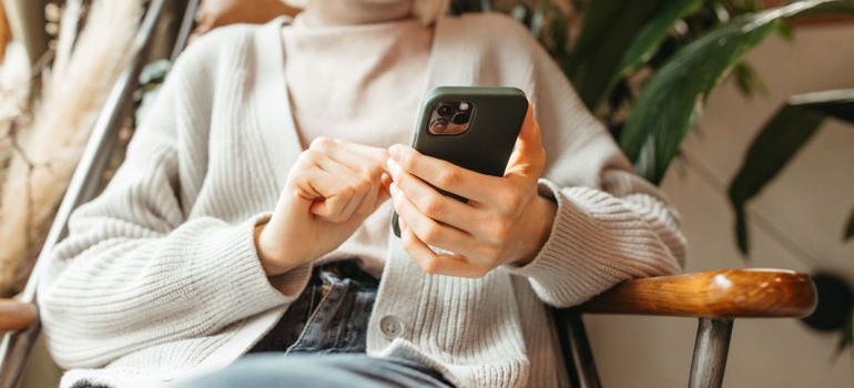A person checking local search results on their phone